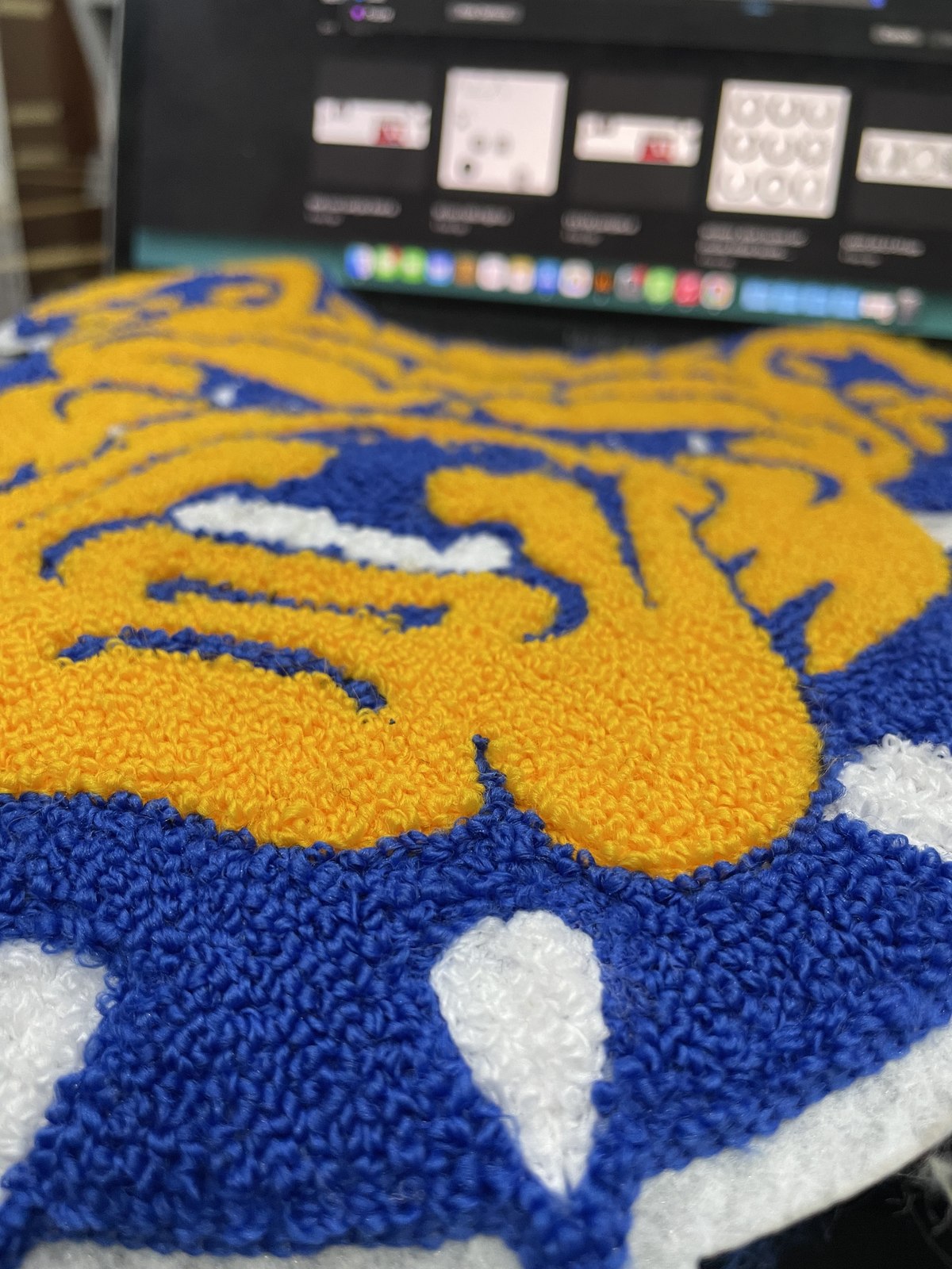 Blue and gold chenille patch detail
