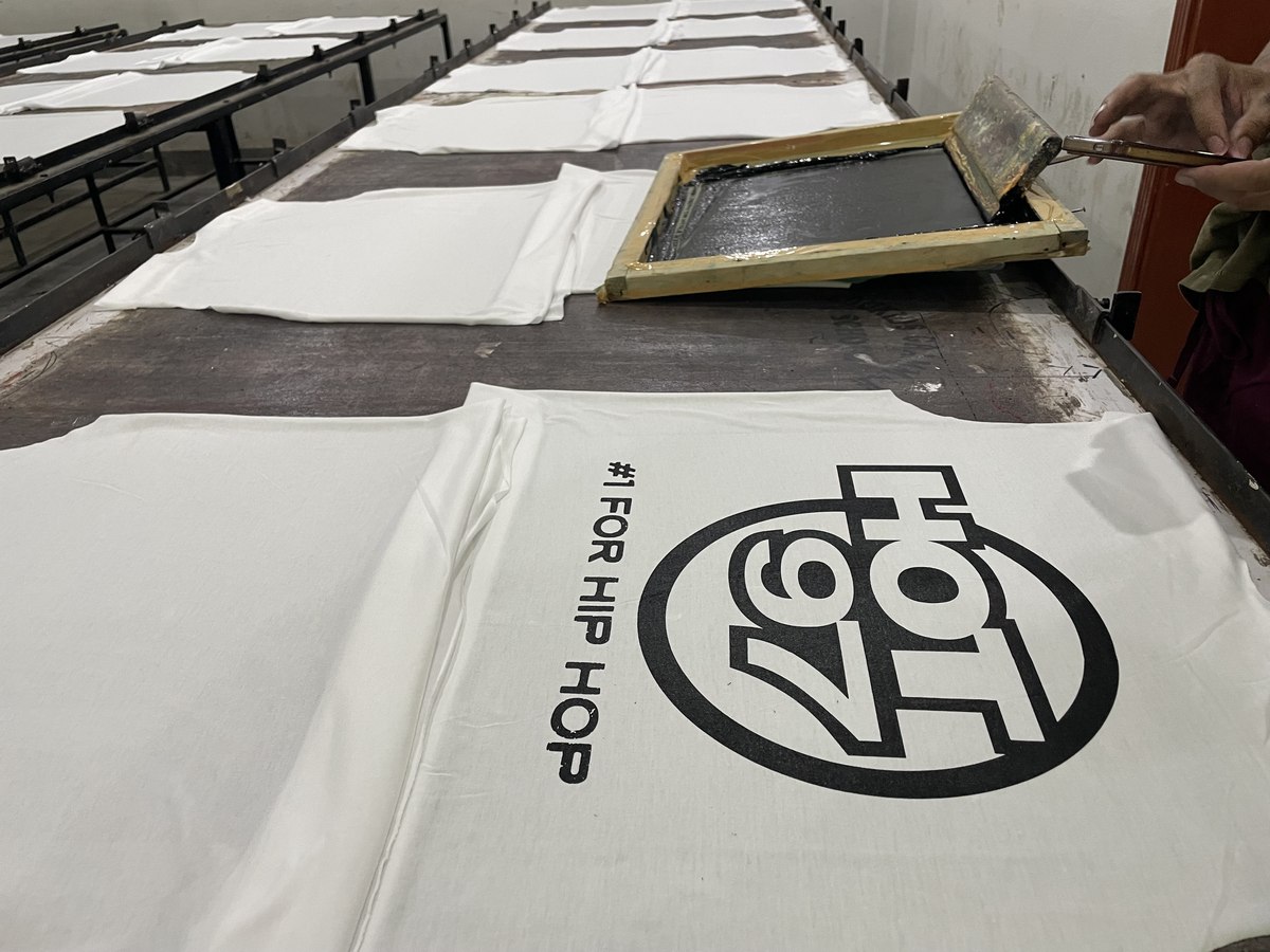 Manual screen printing press running a Hot 97 order