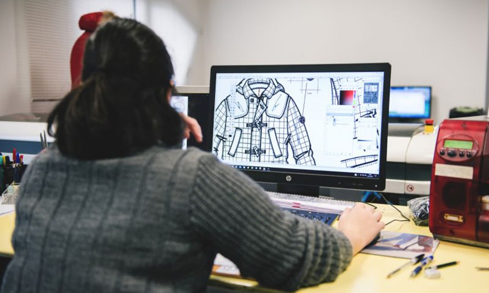 Pattern designer working on a jacket tech pack