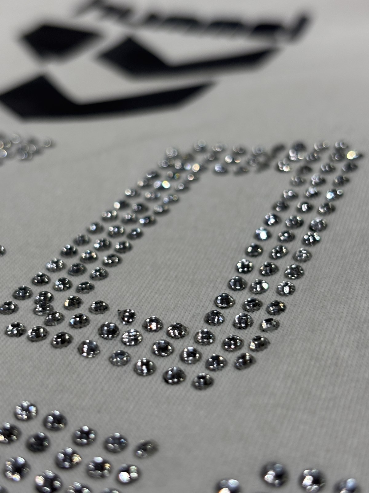 Close-up of rhinestone embellishment on fabric